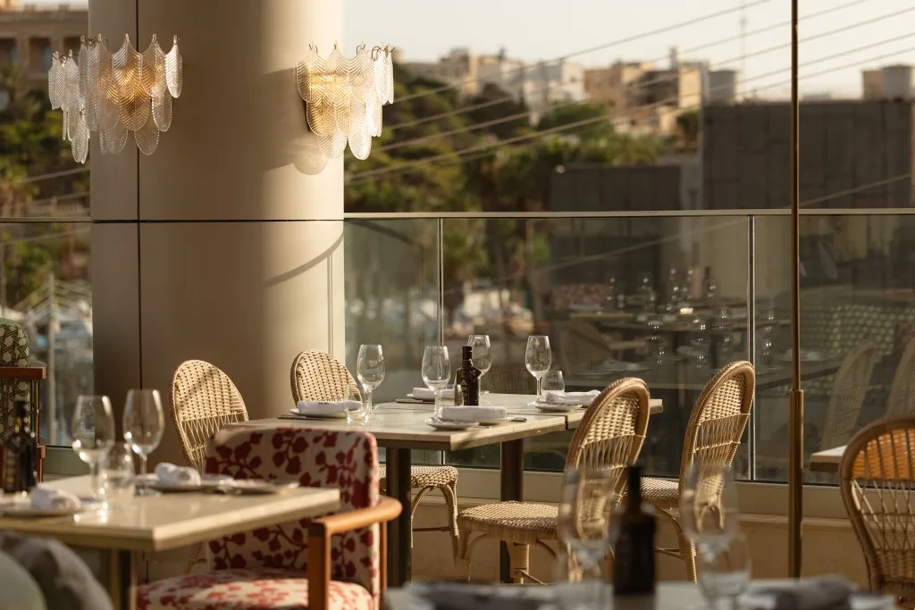 Waterfront dining room at Tatel Spanish restaurant, St George's Bay, St Julian's, Malta